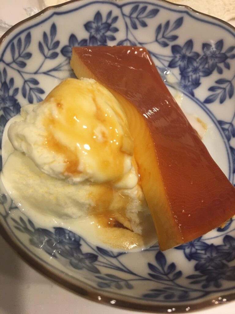 leche flan caramel pudding with vanilla ice cream