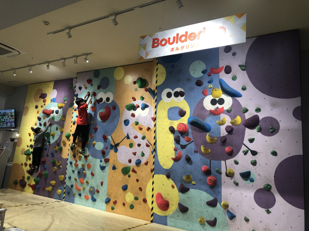 wall climbing bouldering of an indoor playground. with different levels.